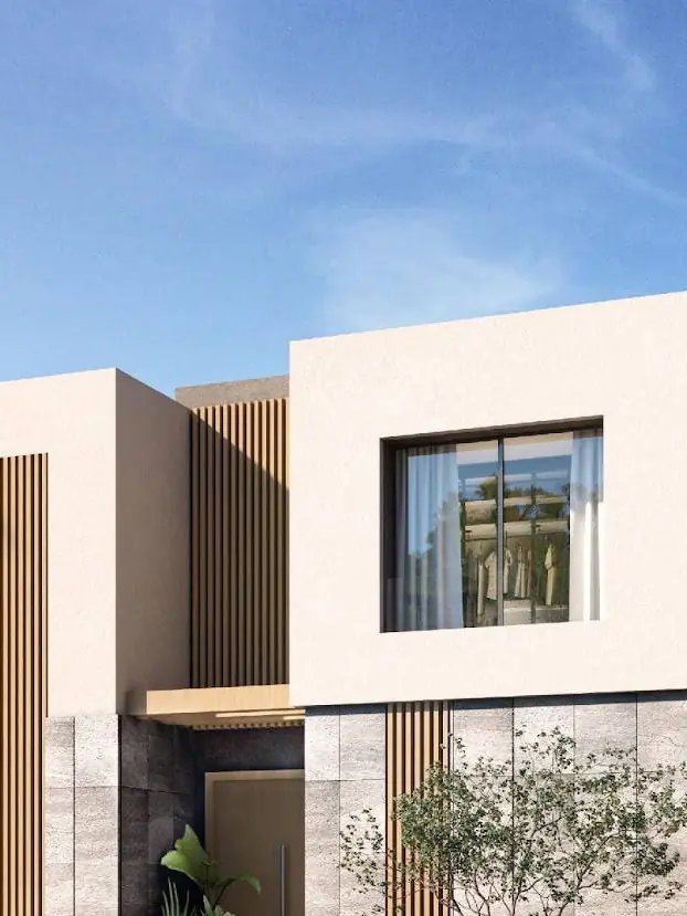 White villas and palm trees at Badya, a Palm Hills community in West Cairo.